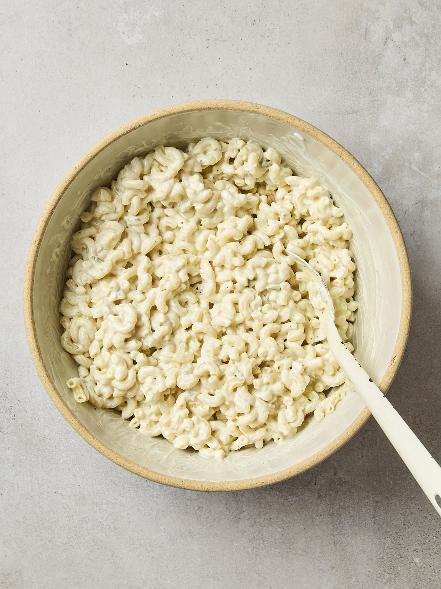 Cooked macaroni and dressing mixed together.