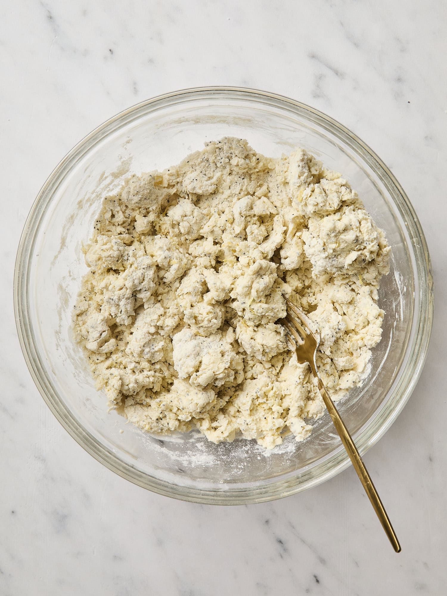 Mixed dough for lemon poppy seed scones.