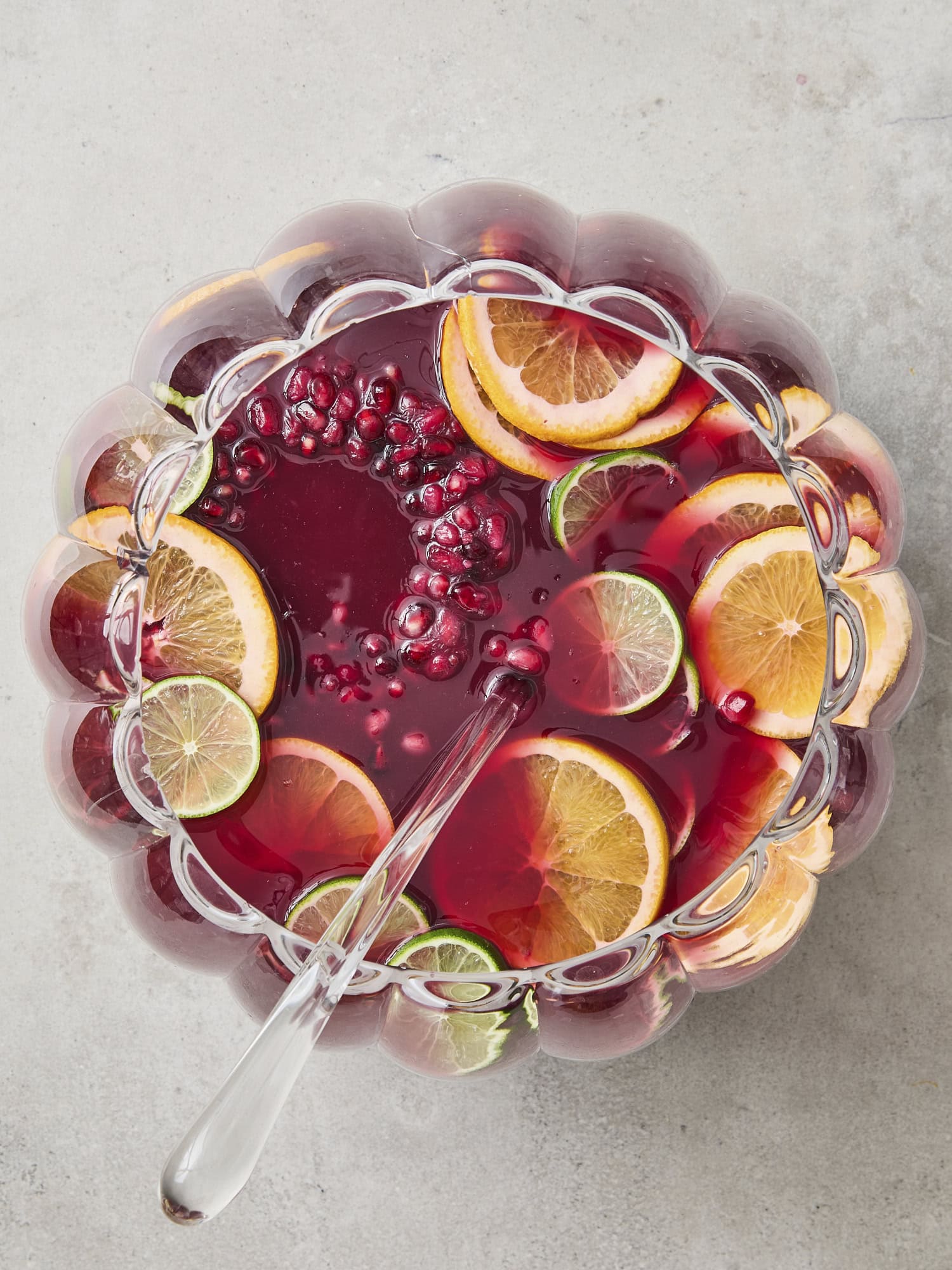 Holiday champagne punch with ice ring and sliced citrus.