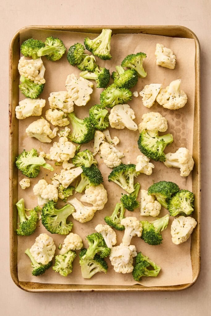 Broccoli and cauliflower on sheet pan before roasting.