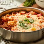 Unstuffed cabbage skillet in a pan with a scoop taken out.