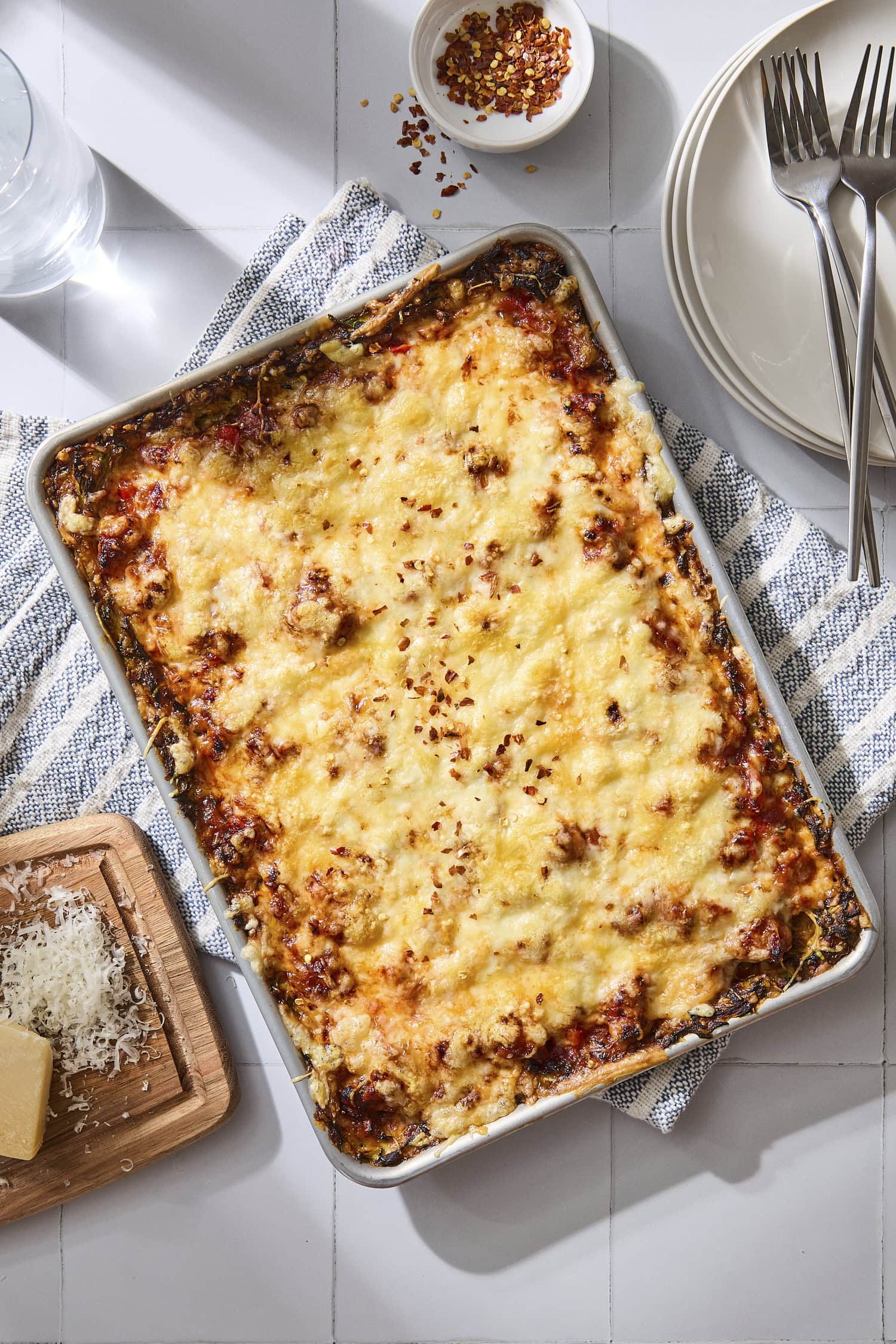 Baked zucchini pizza casserole in a sheet pan.