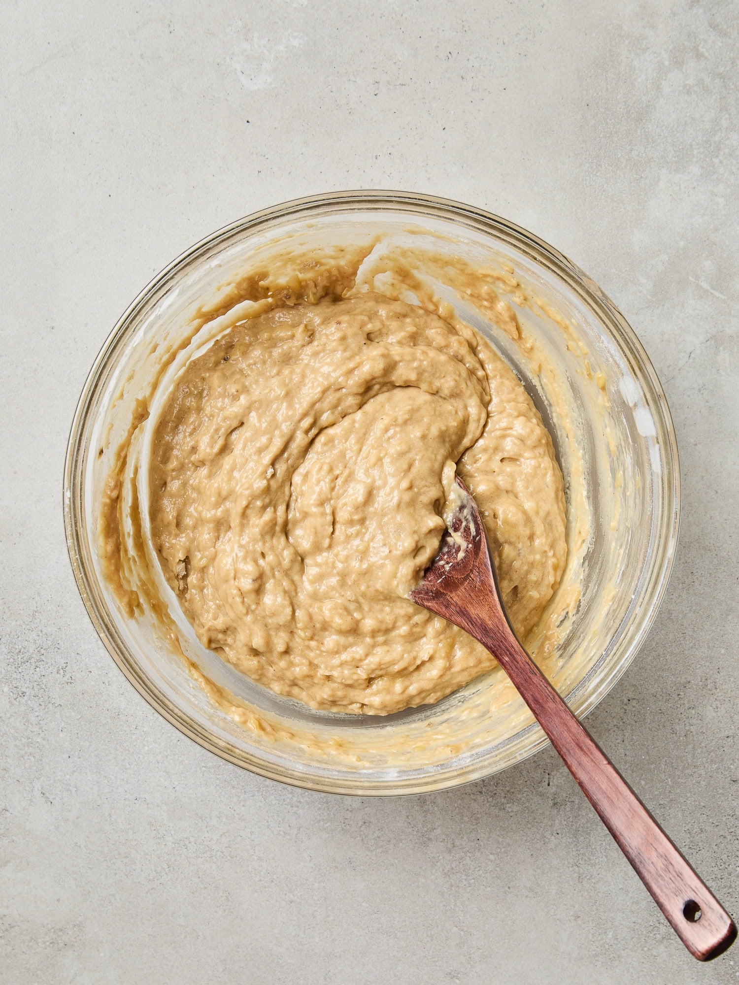 Banana bread batter mixed in a bowl.