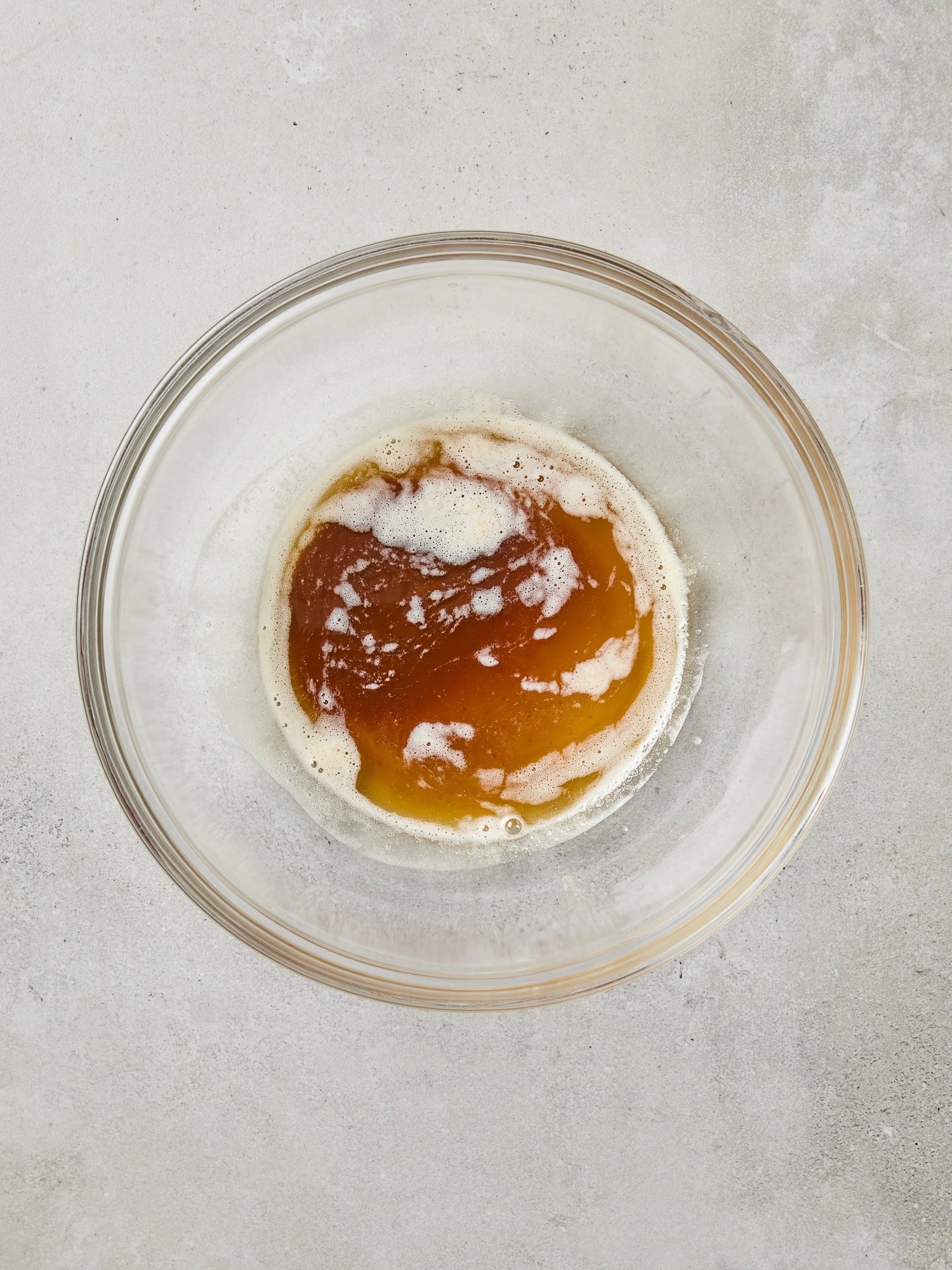 Browned butter in a glass bowl before being added to banana bread.