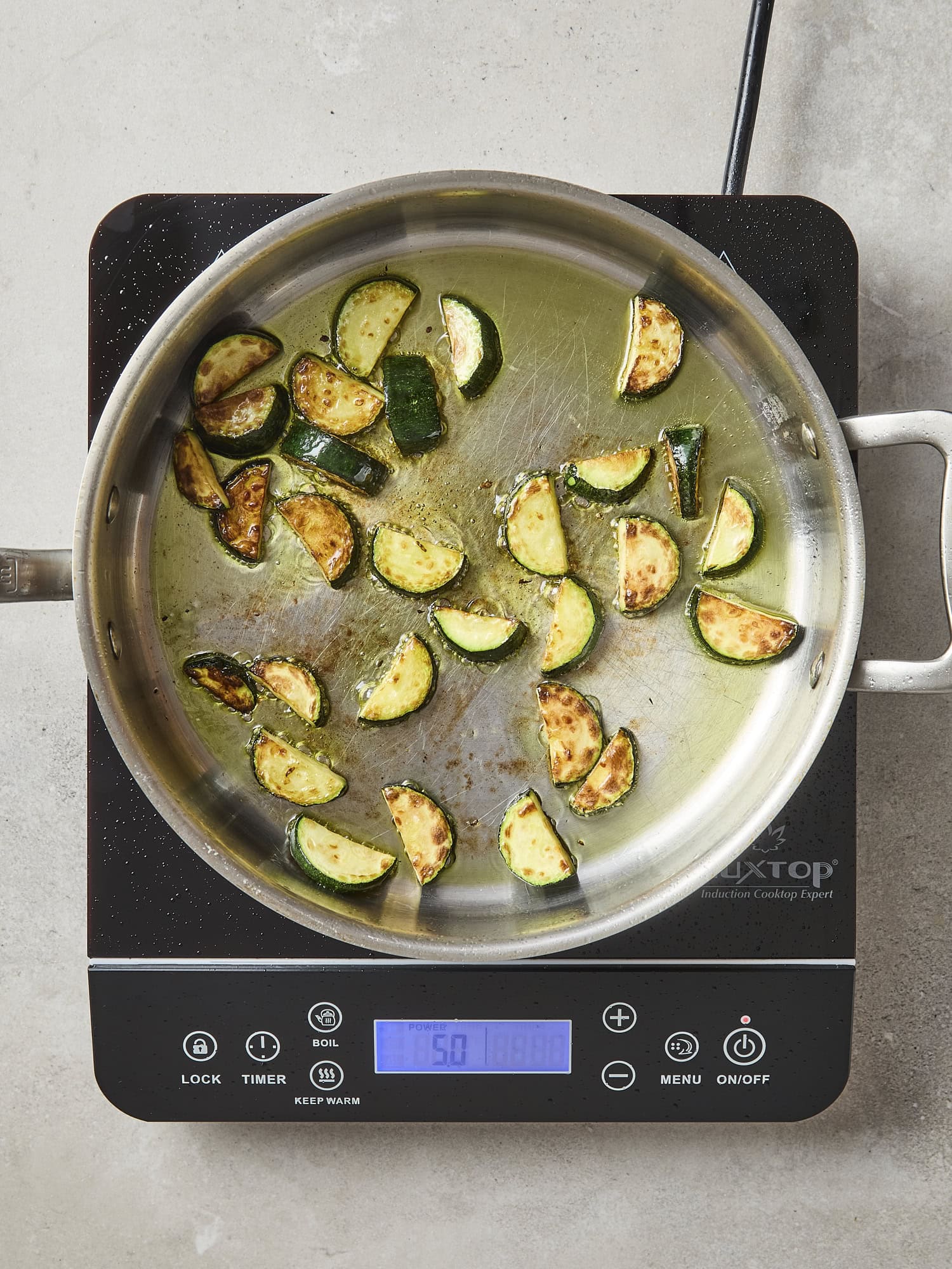 Browned zucchini in a pot.