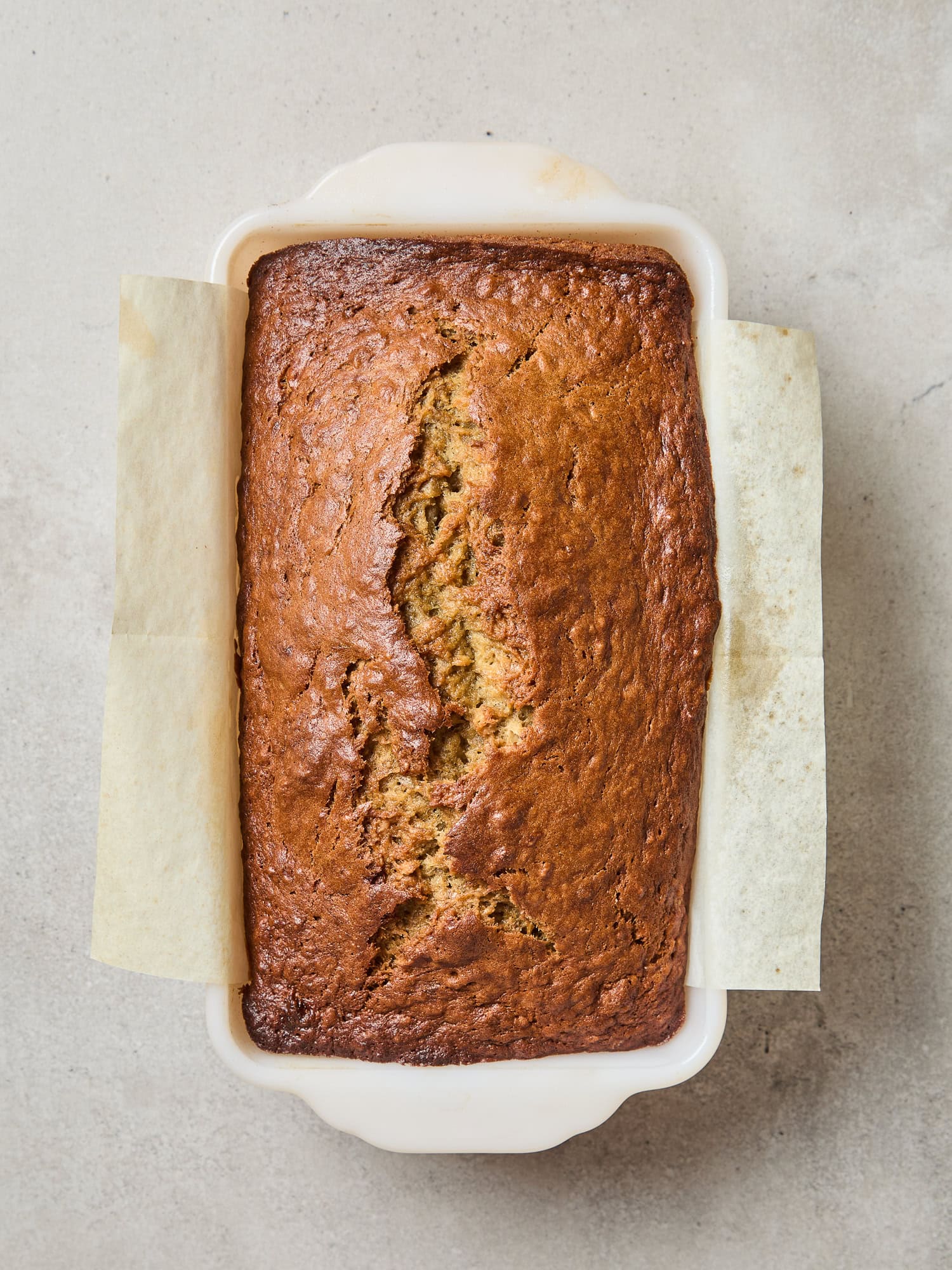 The top of a loaf of banana bread after baking.