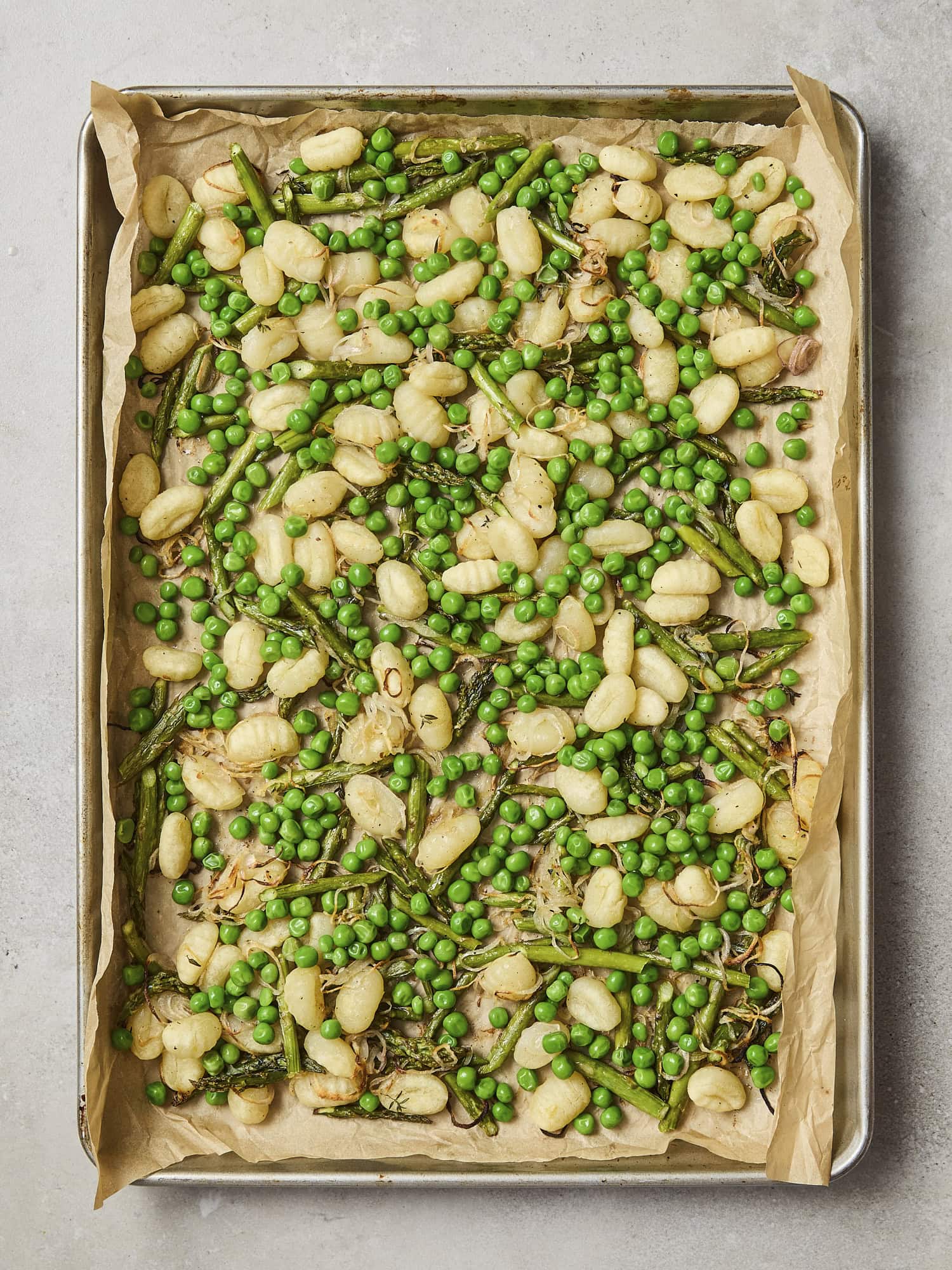 Roasted gnocchi with peas added.