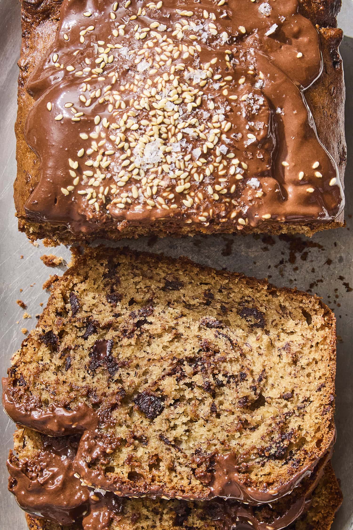 Slices of banana bread with tahini and chocolate chunks inside.