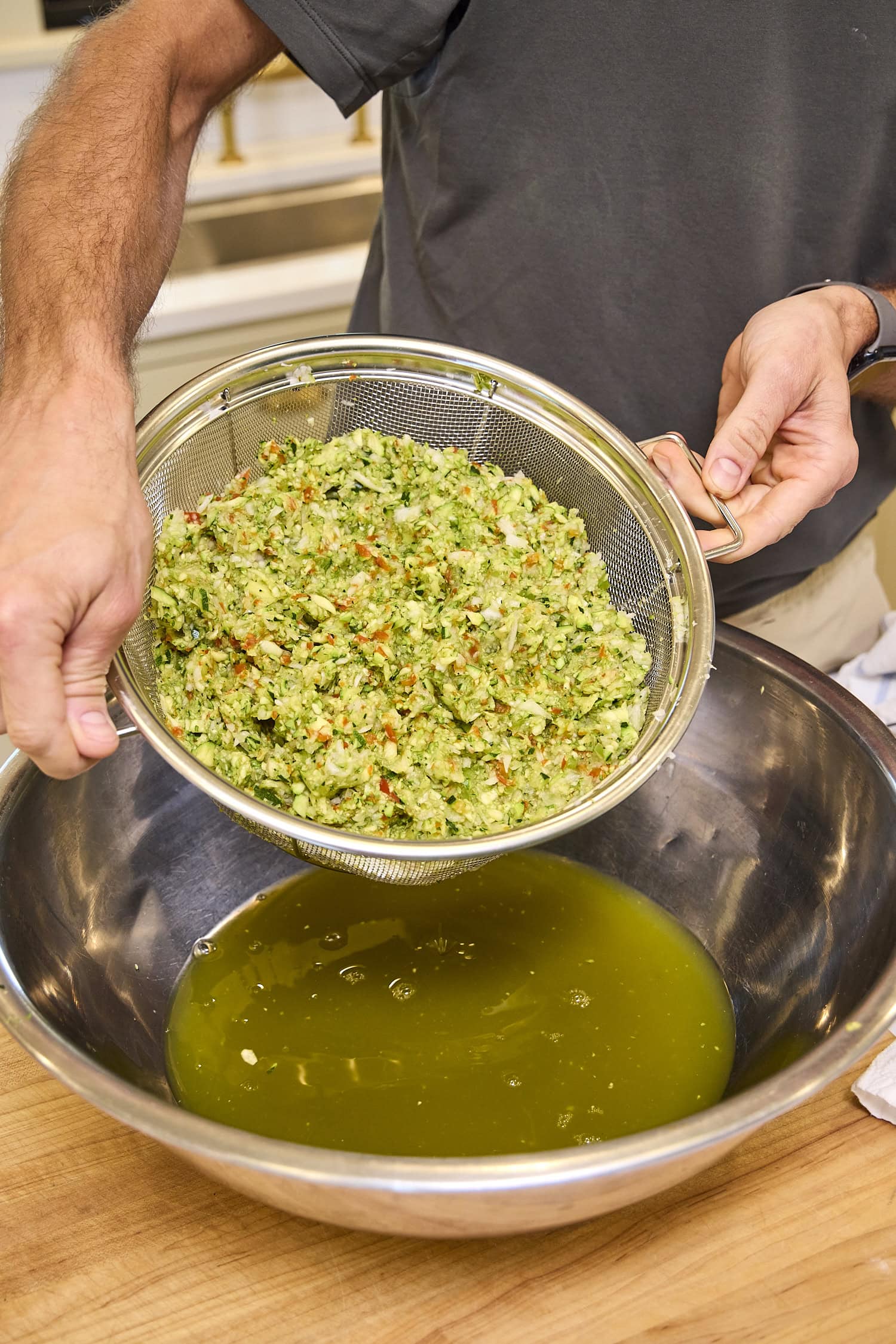 Colander with zucchini after draining.