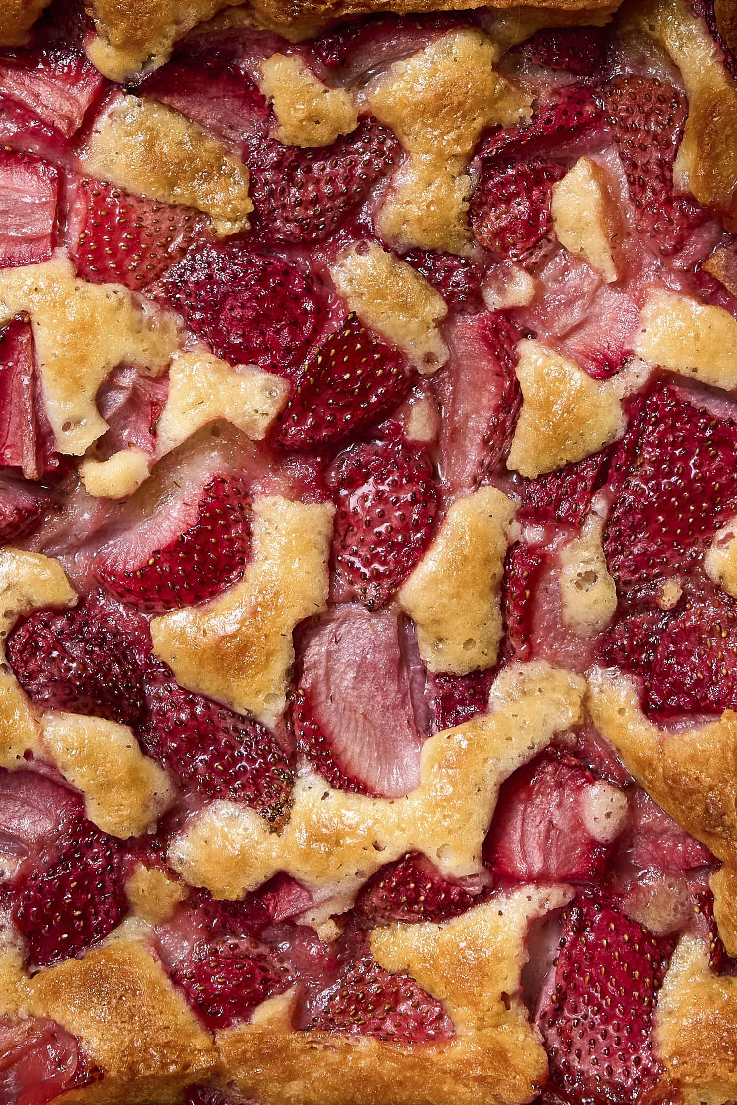 Baked strawberries in cobbler batter.