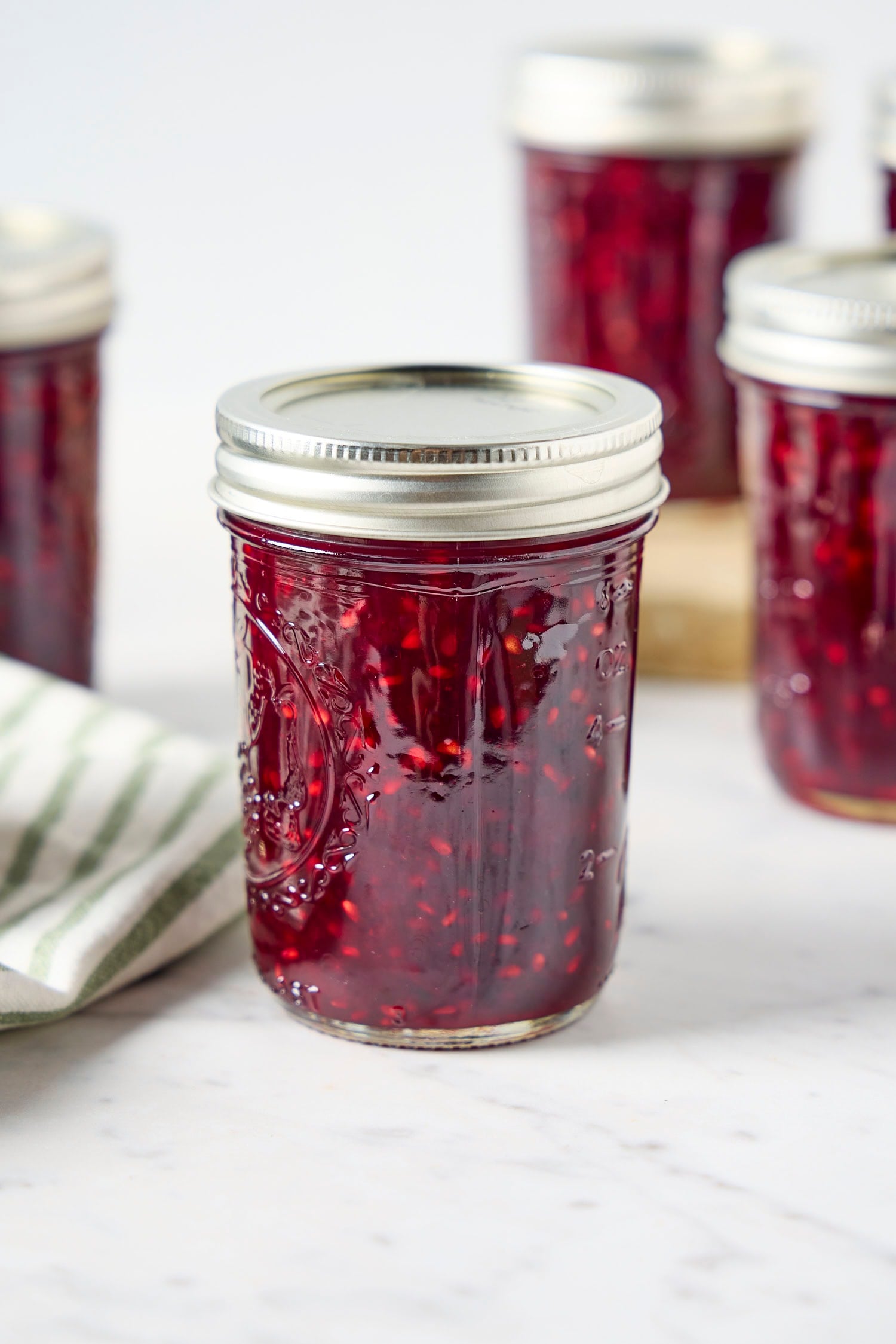 Glass jar filled with homemade blackberry jam.