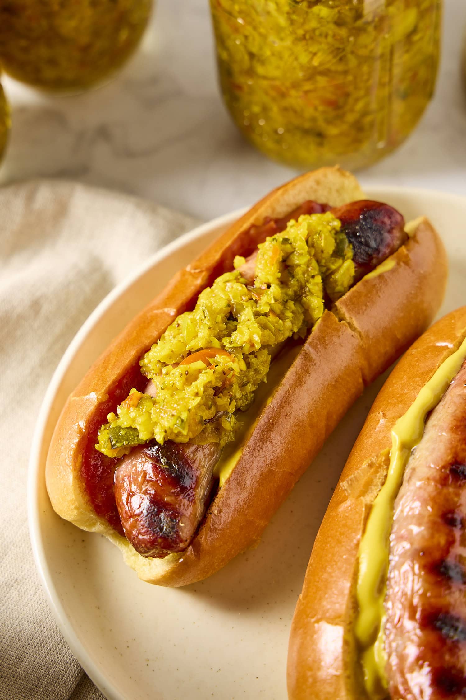 Zucchini relish on top of hot dog.