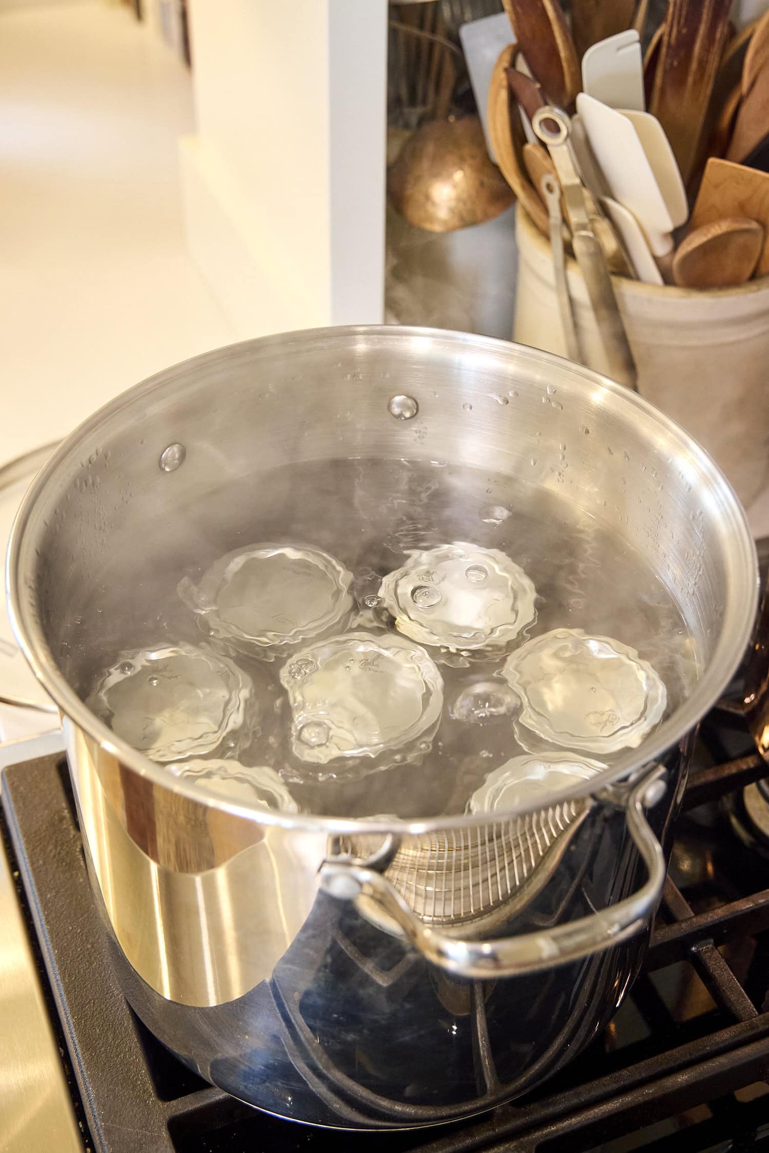 Water bath canner with jars processing.