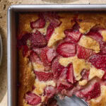 Strawberry cobbler recipe in baking dish.