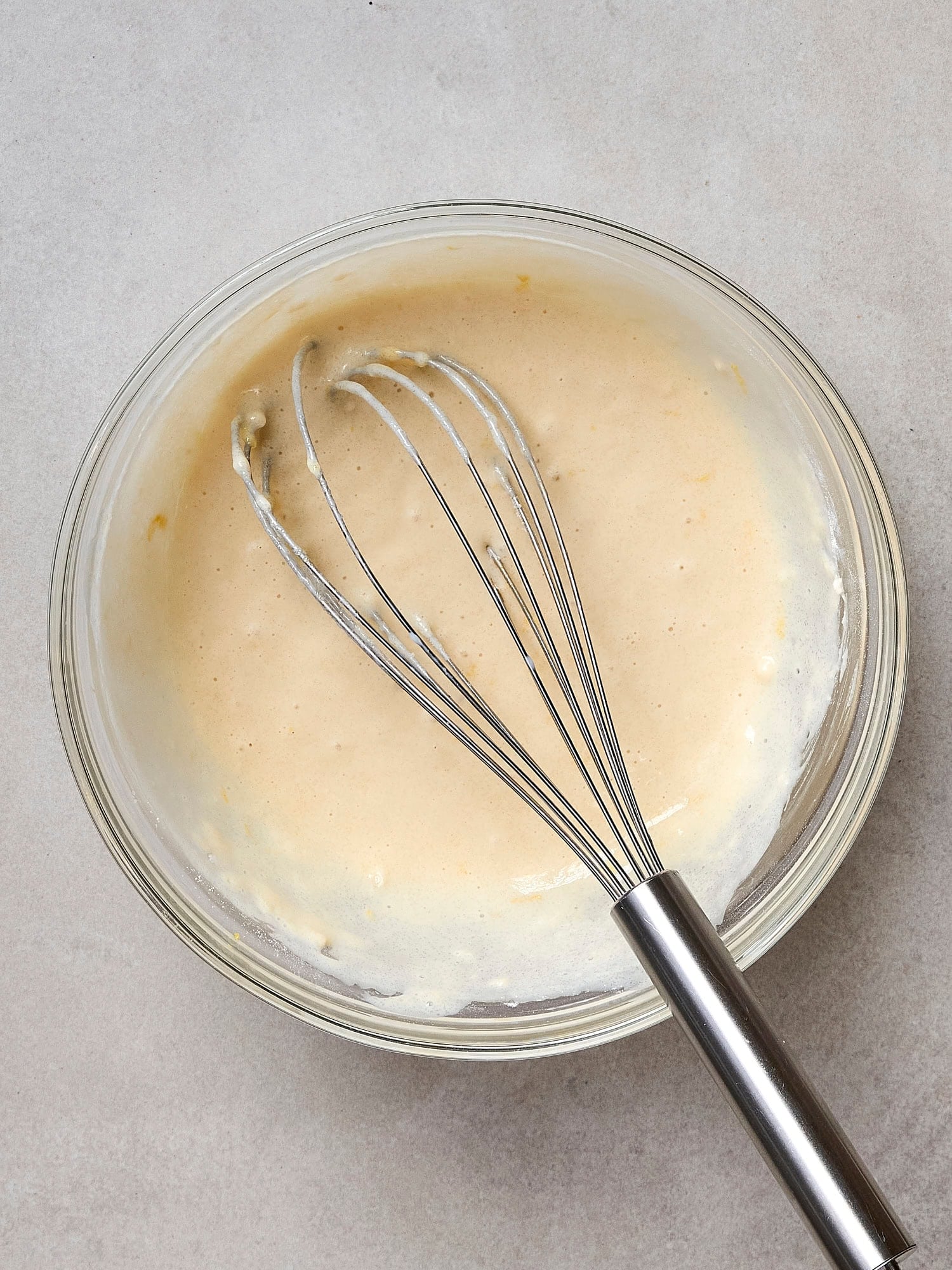 Batter mixed together in bowl for strawberry cobbler.