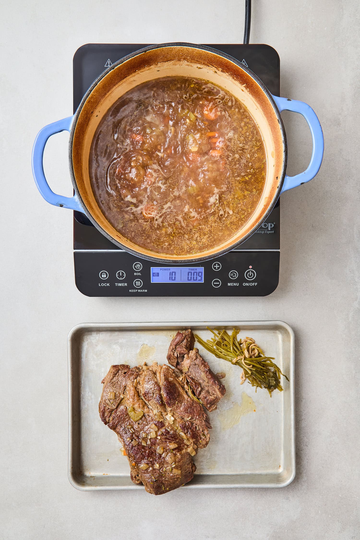 Chuck roast removed after cooking in a Dutch oven.