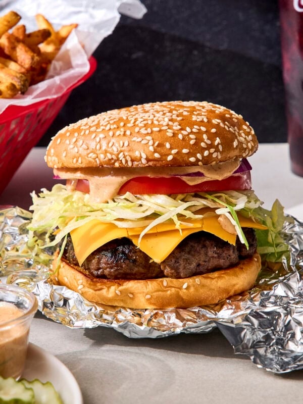 Grilled burger recipe with bun, burger sauce, and more toppings.