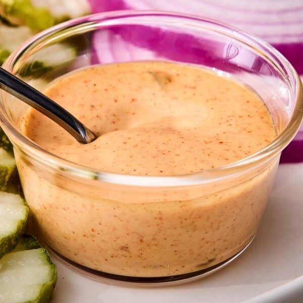 Glass bowl with creamy homemade burger sauce.