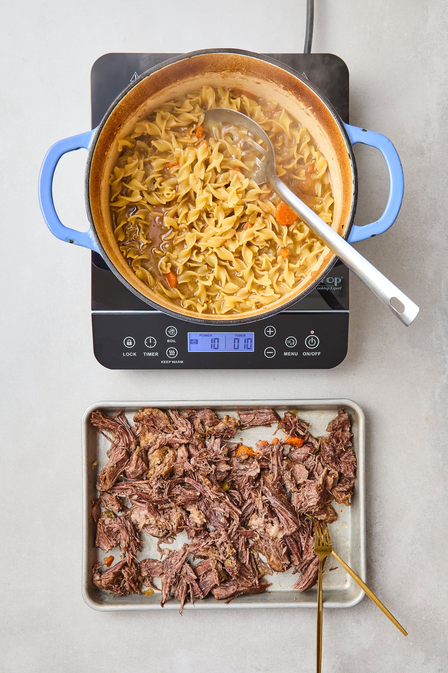 Beef shredded after cooking for beef and noodles.