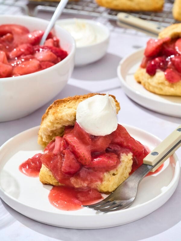 Two biscuits with strawberry rhubarb filling and whipped cream.