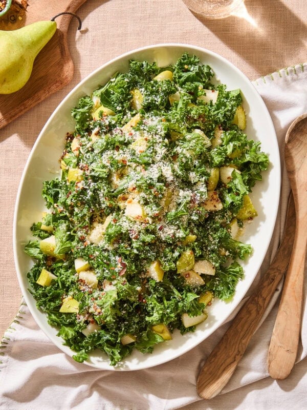 Spicy pear kale salad on a serving platter.
