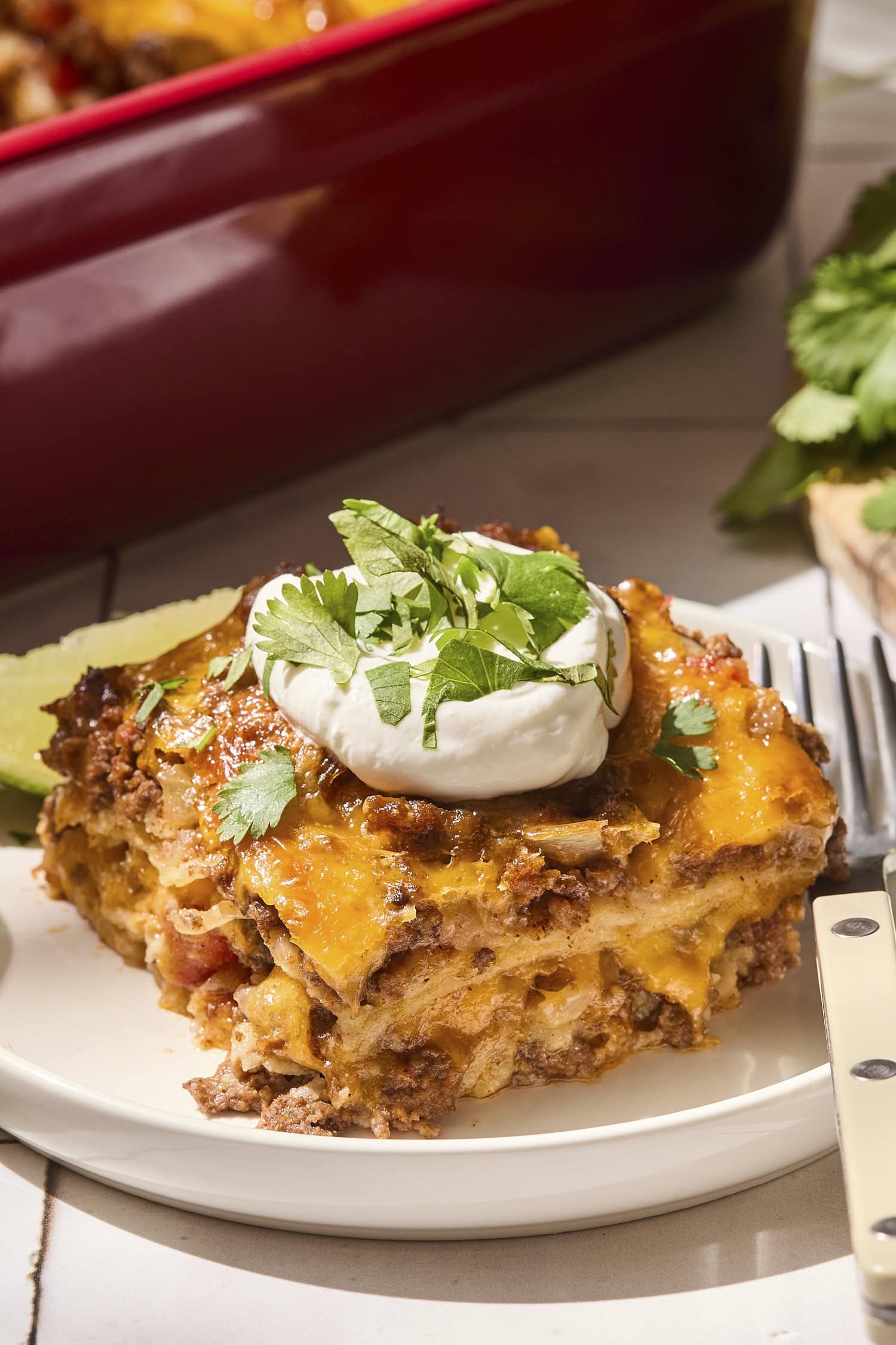 Taco casserole with toppings on top.